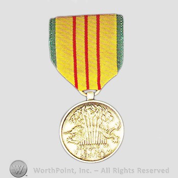Military decoration : Vietnam Service Medal.