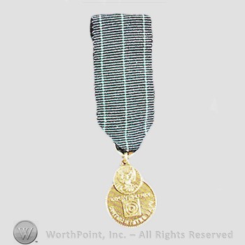 Military decoration : Navy Expert Rifleman Medal.