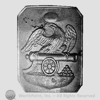 Insignia consisted of plate; eagle above a cannon.