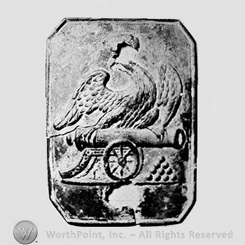 Insignia consisted of plate; eagle above a cannon.