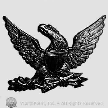 Insignia consisted of an eagle with shield and arrows.