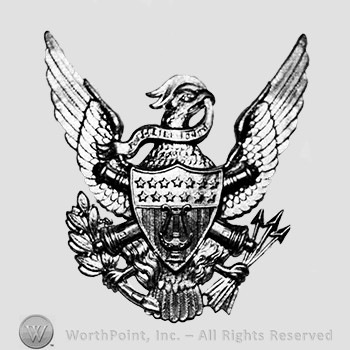 Insignia consisted of crossed cannons with a shield, over an eagle; stars and lyre on the shield.