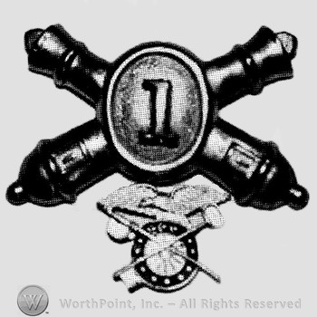 Insignia consisted of crossed cannons and number 1 at the intersection; compass below.
