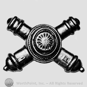 Insignia consisted of crossed cannons with a shield at the intersection.
