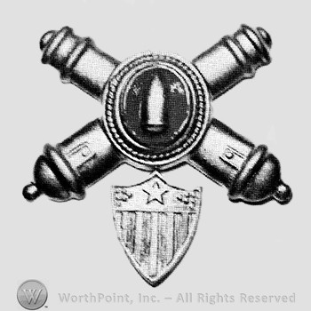 Insignia consisted of crossed cannons with a plate at the intersection; bullet on the plate and a shield below.