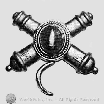Insignia consisted of crossed cannons with a plate at the intersection; bullet on the plate and crescent below.