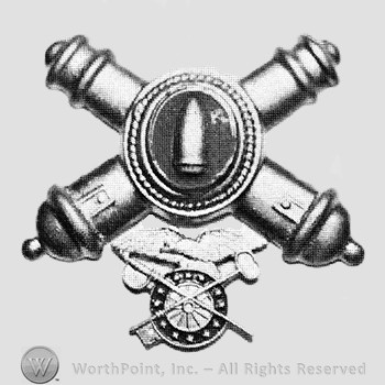 Insignia consisted of crossed cannons with a plate at the intersection; bullet on the plate and a compass below.