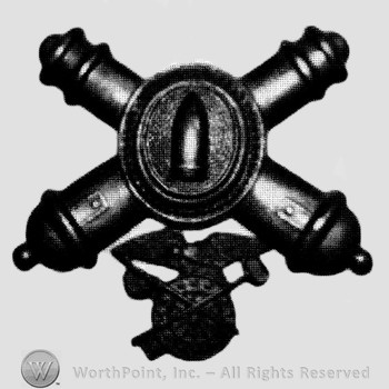 Insignia consisted of crossed cannons with a plate at the intersection; bullet on the plate and a compass below.