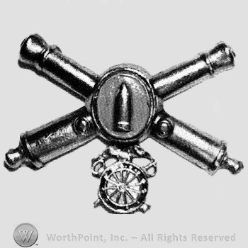 Insignia consisted of crossed cannons and a bullet at the intersection; compass below.