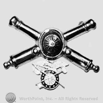Insignia consisted of crossed cannons and a shield at the intersection; compass below.
