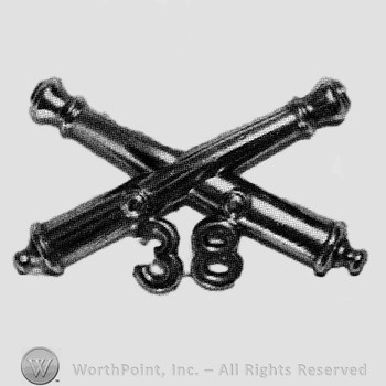 Insignia consisted of crossed cannons and number 38 below.