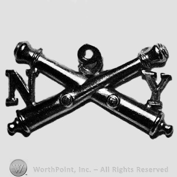 Insignia consisted of crossed cannons and letters N on the left and Y on the right; number 9 above.