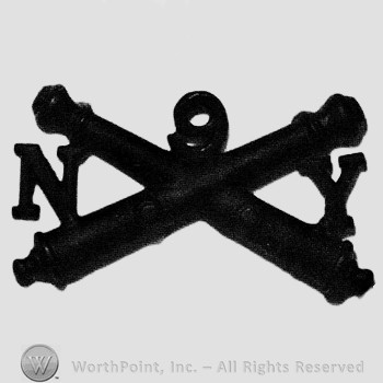 Insignia consisted of crossed cannons and letters N on the left and Y on the right; number 9 above.