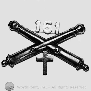Insignia consisted of crossed cannons and number 161 above; cross below.