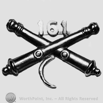 Insignia consisted of crossed cannons and number 161 above; crescent below.