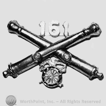 Insignia consisted of crossed cannons and number 161 above; wheel below.