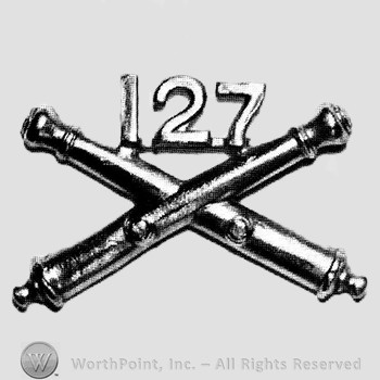 Insignia consisted of crossed cannons and number 127 above.