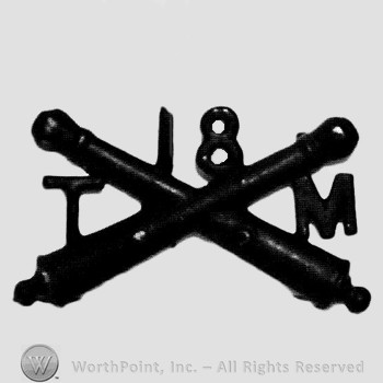 Insignia consisted of crossed cannons; letter T on the left, number 18 above and letter M on the right.
