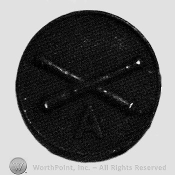 Insignia consisted of crossed cannons and letter A below; all on a disc.