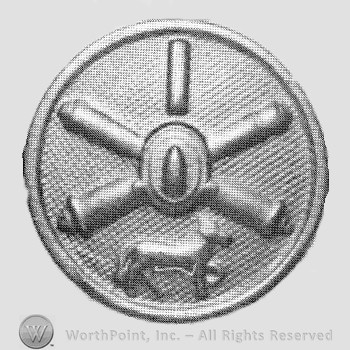 Insignia consisted of crossed cannons with a bullet at the intersection; dog below; all on a disc.