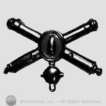 Insignia consisted of crossed cannons and bullet at the intersection; shell below.