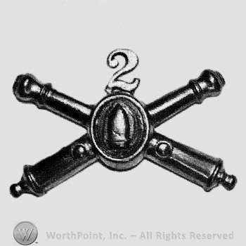 Insignia consisted of crossed cannons with bullet at the intersection and number 2 above.