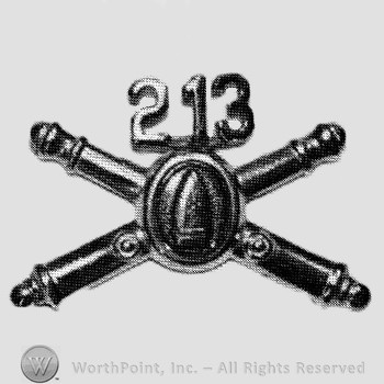 Insignia consisted of crossed cannons with bullet at the intersection and number 213 above.