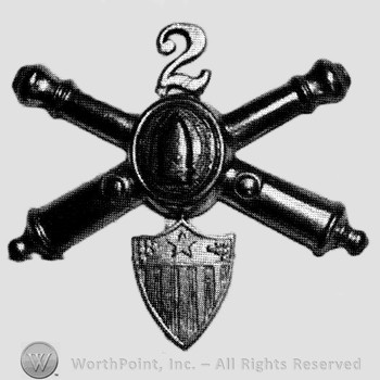 Insignia consisted of crossed cannons with bullet at the intersection and number 2 above; shield below.