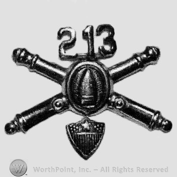 Insignia consisted of crossed cannons with bullet at the intersection and number 213 above; shield below.