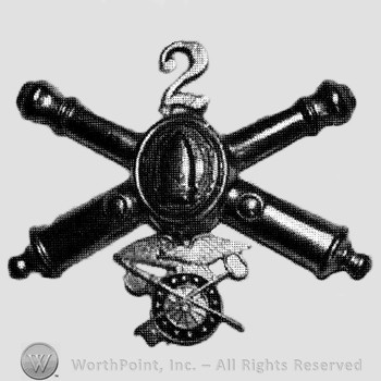 Insignia consisted of crossed cannons with bullet at the intersection and number 2 above; wheel below.