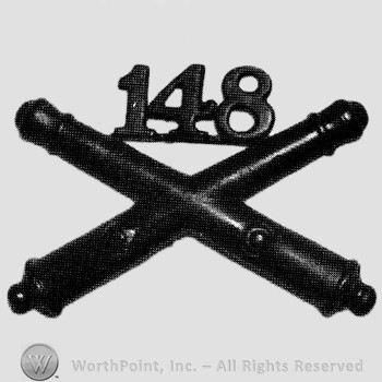 Insignia consisted of crossed cannons and number 148 above.