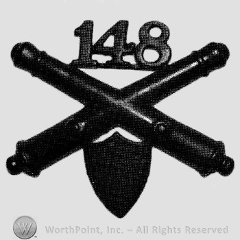 Insignia consisted of crossed cannons, number 148 above and a shield below.