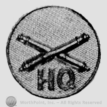 Insignia consisted of crossed cannons  and letters HQ below; all on a plate.