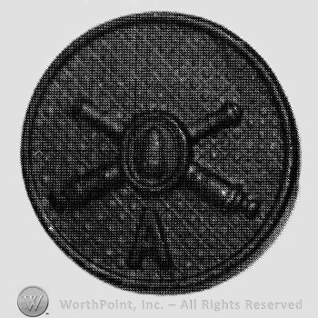 Insignia consisted of crossed cannons with a bullet at the intersection and letter A below; all on a plate.