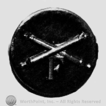 Insignia consisted of crossed cannon and letter F below; all on a plate.