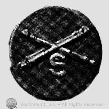 Insignia consisted of crossed cannon and letter S below; all on a plate.