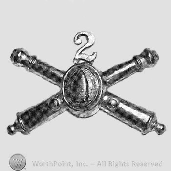 Insignia consisted of crossed cannon with a bullet at the intersection; number 2 above.
