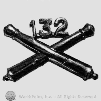 Insignia consisted of crossed cannon and number 132 above.
