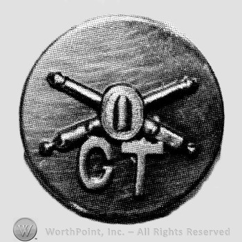 Insignia consisted of crossed cannon with a bullet at the intersection and letters CT below; all on a plate.