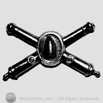 Insignia consisted of crossed cannon with a bullet at the intersection.