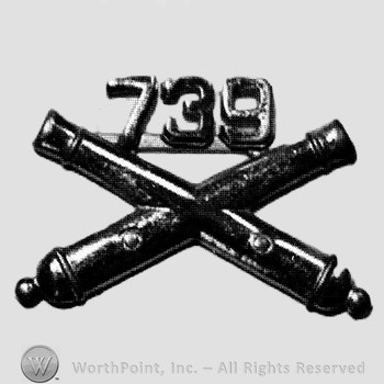 Insignia consisted of crossed cannon and number 739 above.