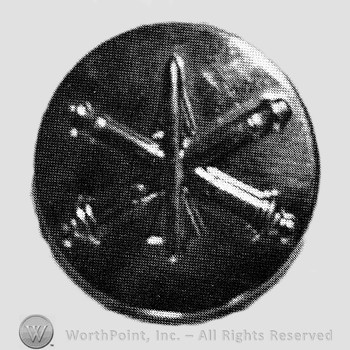 Insignia consisted of crossed cannon with a missile at the intersection; all on a plate.