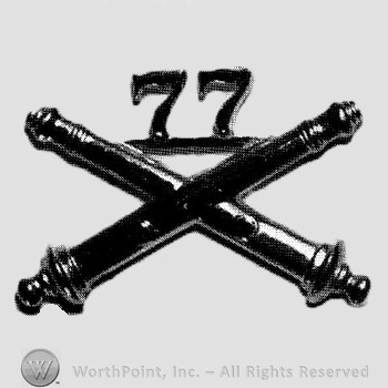Insignia consisted of crossed cannon and number 77 above.