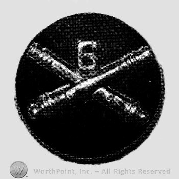 Insignia consisted of crossed cannon and number 6, all on a disc.