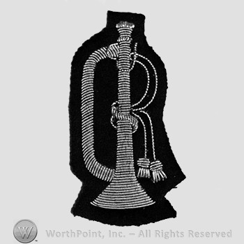 Insignia consisted of  a trumpet; embroidered.