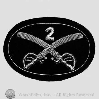 Insignia consisted of crossed sabres and number 2 at the intersection; embroidered.