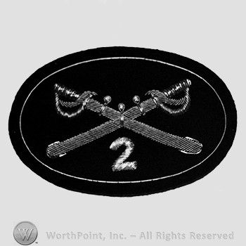 Insignia consisted of crossed sabres and number 2 at the intersection; embroidered.
