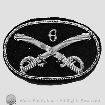 Insignia consisted of crossed swords and number 6 above; embroidered.