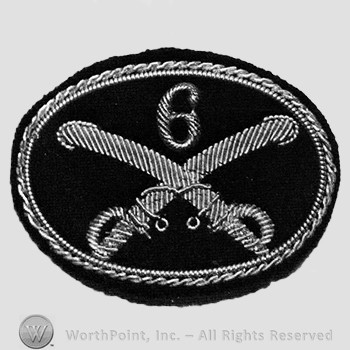 Insignia consisted of crossed swords and number 6 above; embroidered.