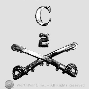 Insignia consisted of crossed swords and nuber 2 and letter C above.